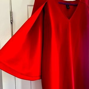 Women’s Red cape dress.